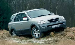 a picture of the Kia sorrento going across some rough ground